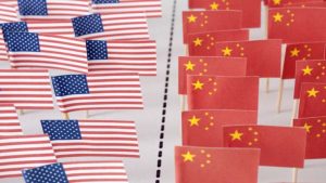 Conceptual image of American and China flags separated by dotted line